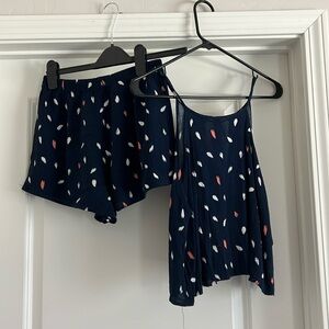 Size small two piece short and top. Top has tie back